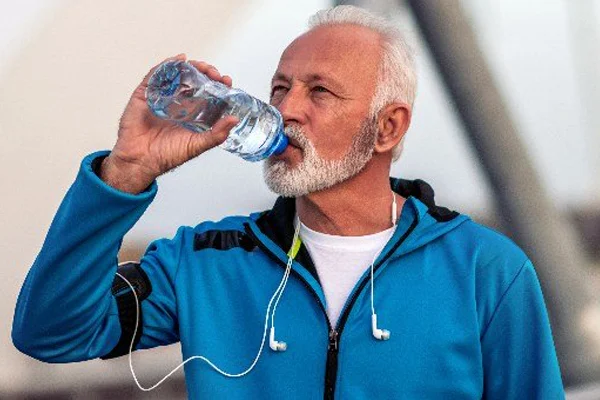 Why is it harmful to drink water standing up